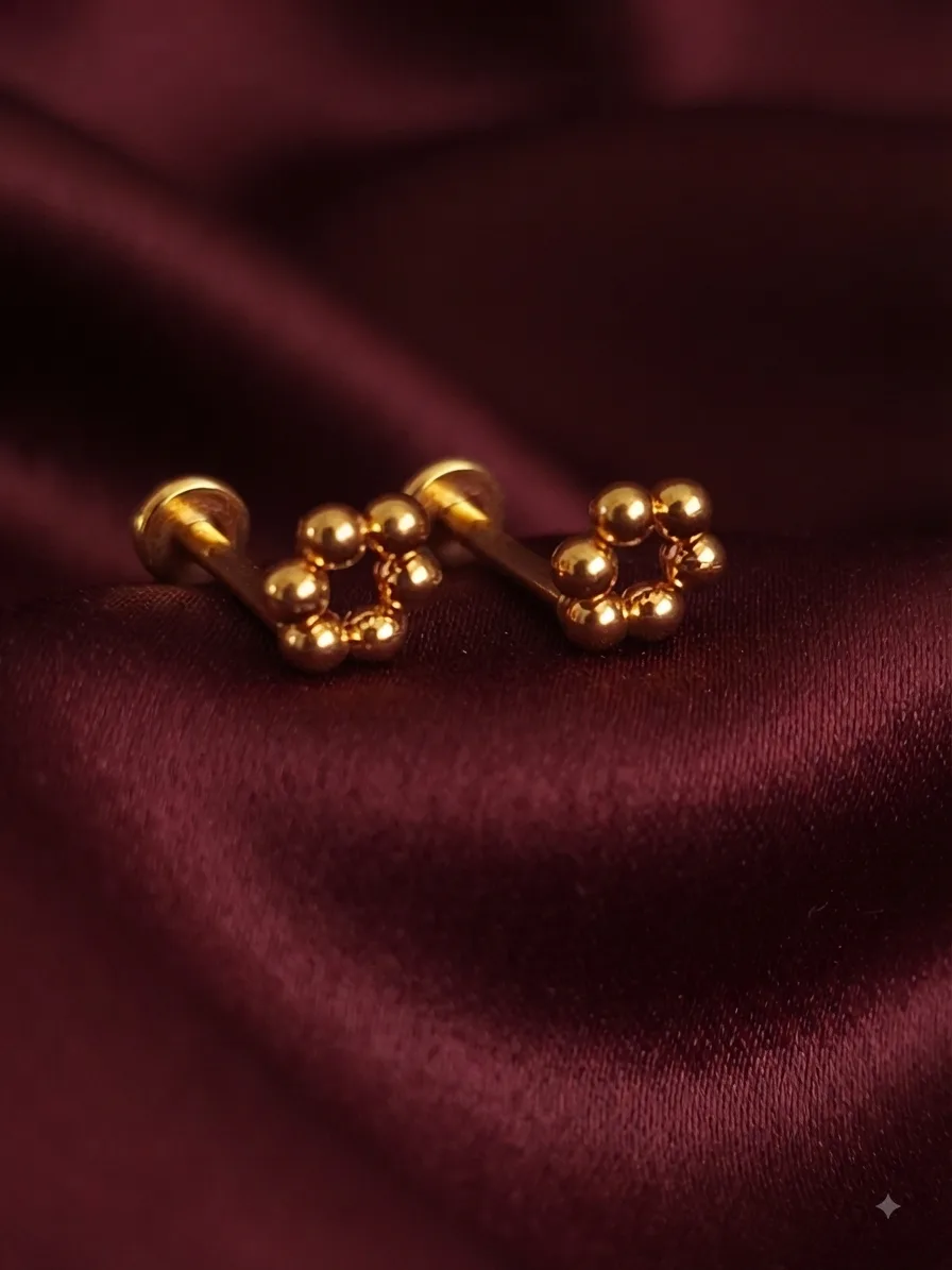 A slim plain gold-plated stud